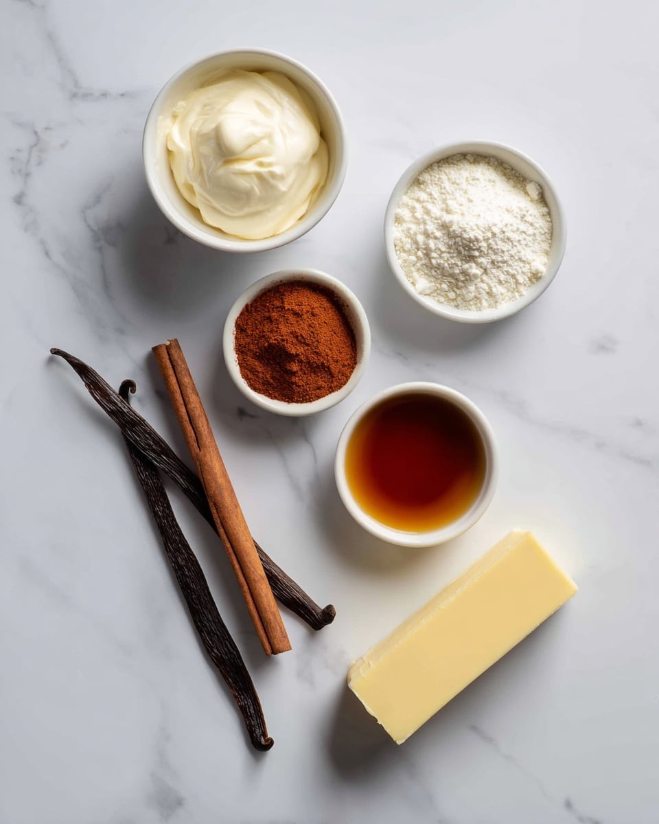 The image shows five main ingredients arranged on a white marbled surface: a small white bowl with smooth white cream at the top left, a small white bowl filled with fine white powder at the top right, a smaller white bowl with reddish-brown powder near the center left, a small white bowl with dark amber liquid near the center right, and a long stick of pale yellow butter placed diagonally at the bottom center. Two dark brown cinnamon sticks are placed diagonally near the bottom left corner. The light is soft and the scene is clean and bright, photo taken with an iphone --ar 4:5 --v 7