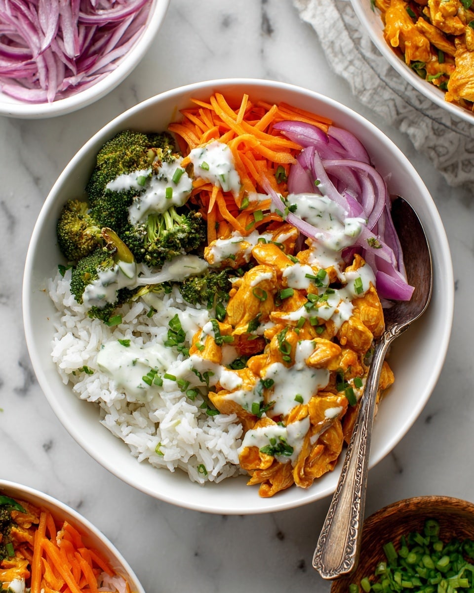 A white bowl sits on a white marbled surface, filled with several layers of food. The bottom layer is white rice on one side. Next to it are small orange pieces of cooked tofu or chicken covered with a creamy white sauce. On top of that is a layer of thin orange carrot strips mixed with some green chopped scallions. Purple-red onion slices are spread over the carrots and protein. On the opposite side of the bowl are green pieces of cooked broccoli also drizzled with the same white sauce. A metal spoon with a wooden handle rests inside the bowl. In the background, there are white bowls with red onion and another dish slightly blurred. photo taken with an iphone --ar 4:5 --v 7