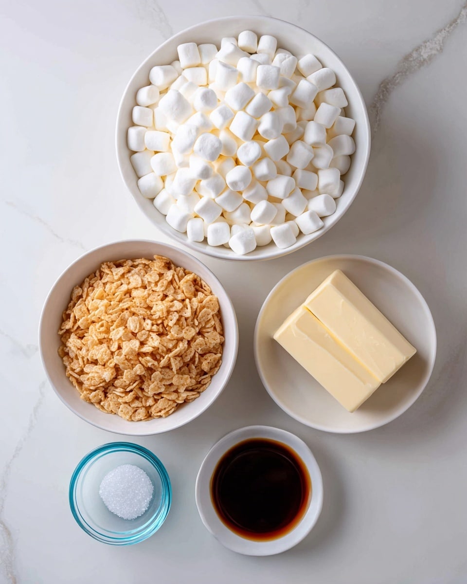 The image shows five ingredients neatly arranged on a white marbled surface. At the top, a white bowl is filled with many small, white mini marshmallows, creating a soft, puffy texture. Below it, another white bowl is full of golden-brown crispy rice cereal, with a crunchy look. To the right of these bowls, two sticks of pale yellow salted butter are placed side by side. Below the butter, a small clear blue glass bowl contains a small amount of white salt crystals, and next to it is a small white dish holding a dark brown liquid vanilla extract. The ingredients are clearly labeled with black and white text. Photo taken with an iphone --ar 4:5 --v 7