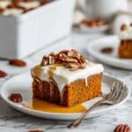 Pumpkin Poke Cake with Caramel, Cream Cheese Frosting, and Pecans Recipe