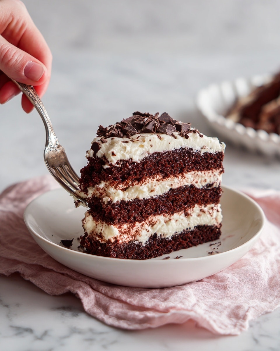 The image shows a white bowl holding a slice of layered chocolate cake. The cake has four layers of dark brown chocolate cake, separated by three layers of light cream filling. The top layer of the cake is covered with cream and has small chocolate pieces on the side. A silver fork held by a woman's hand is lifting a piece of the cake from the bowl. The background is a white marbled surface with a pink cloth near the edge of the bowl. On the side, there is a white dish with more of the chocolate cake visible. Photo taken with an iphone --ar 4:5 --v 7