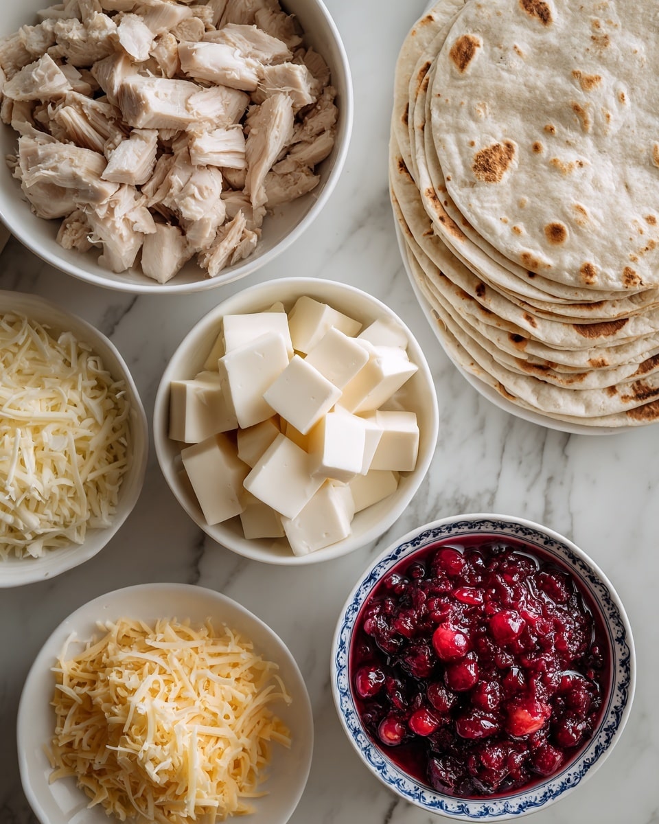 A white bowl at the top left holds light and dark pieces of leftover turkey or chicken. Next to it on the right is a small white bowl filled with cubes of brie cheese, creamy white with a soft texture. On the right side of the image, there’s a stack of pale beige tortillas with light brown spots, arranged in a neat pile. Below the turkey bowl are two small white plates; the left plate has a pile of shredded mozzarella cheese, soft and pale yellow, while the right plate holds a mound of shredded cheddar cheese, a bit darker and more textured. At the bottom right, a small white bowl with blue patterns contains bright red cranberry sauce with visible whole berries, looking shiny and thick. The background is a white marbled surface. Photo taken with an iphone --ar 4:5 --v 7