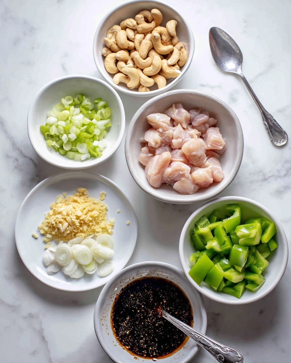 There are five white plates and bowls placed on a white marbled surface, each holding different ingredients. The center bowl contains raw, pale pink chicken cut into small chunks. Above it, a bowl is filled with light brown roasted cashew nuts. To the right, another bowl holds bright green bell pepper pieces. Below that, a bowl contains dark brown sauce with bubbles on top and a silver spoon inside. On the left, a small white plate has three piles of chopped ingredients: pale yellow minced ginger, light green sliced green onions, and white sliced garlic. Photo taken with an iphone --ar 4:5 --v 7
