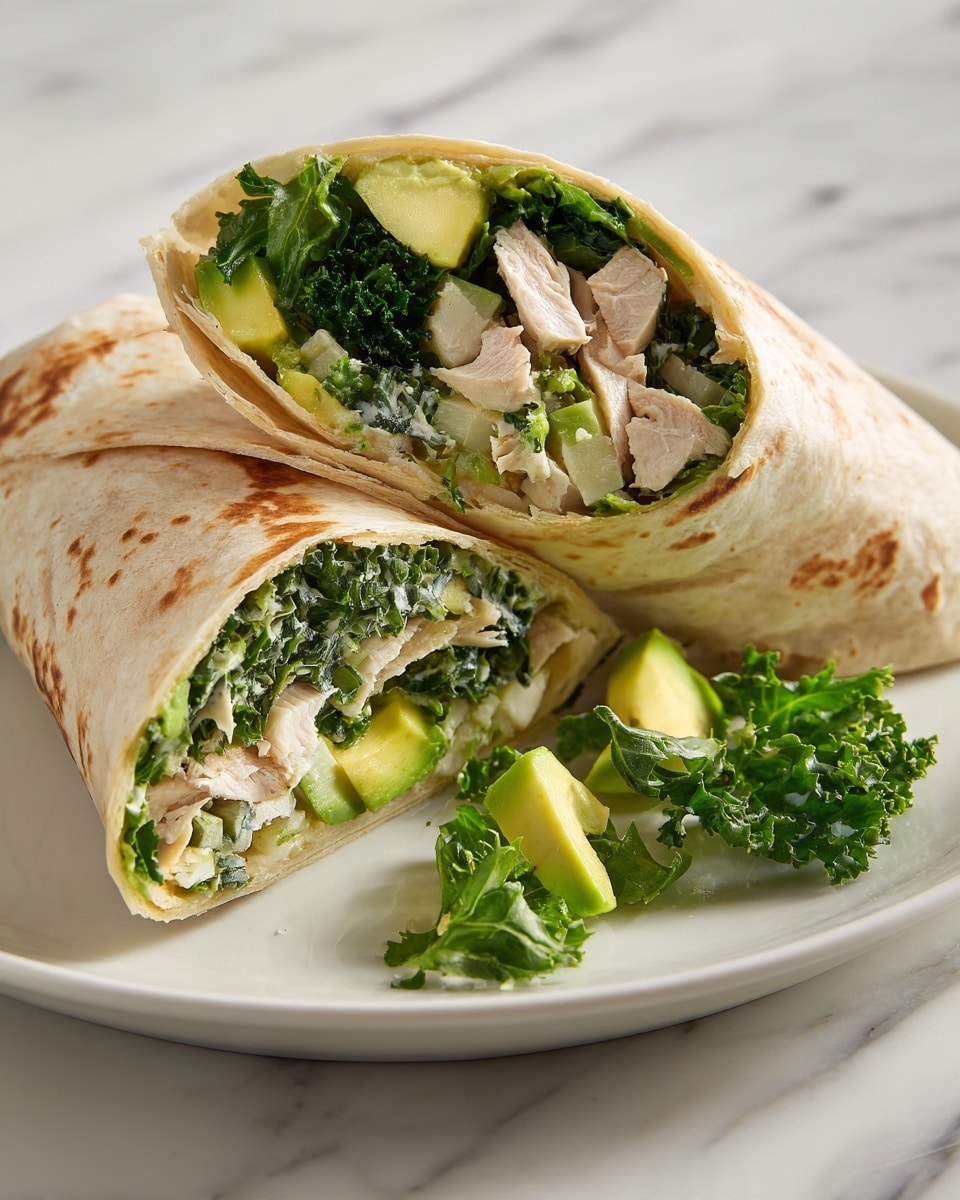 Two large wraps are cut in half and placed on a white plate with a white marbled surface. Each wrap has a lightly toasted beige tortilla on the outside. Inside, there are three main visible layers: a chopped dark green leafy vegetable layer mixed with light green and white pieces; thick, pale slices of cooked poultry; and chunks of fresh avocado adding a creamy yellow-green touch. Some small pieces of leafy greens are scattered on the plate near the wrap halves. The overall look is fresh and healthy with a mix of creamy, crunchy, and tender textures. photo taken with an iphone --ar 4:5 --v 7